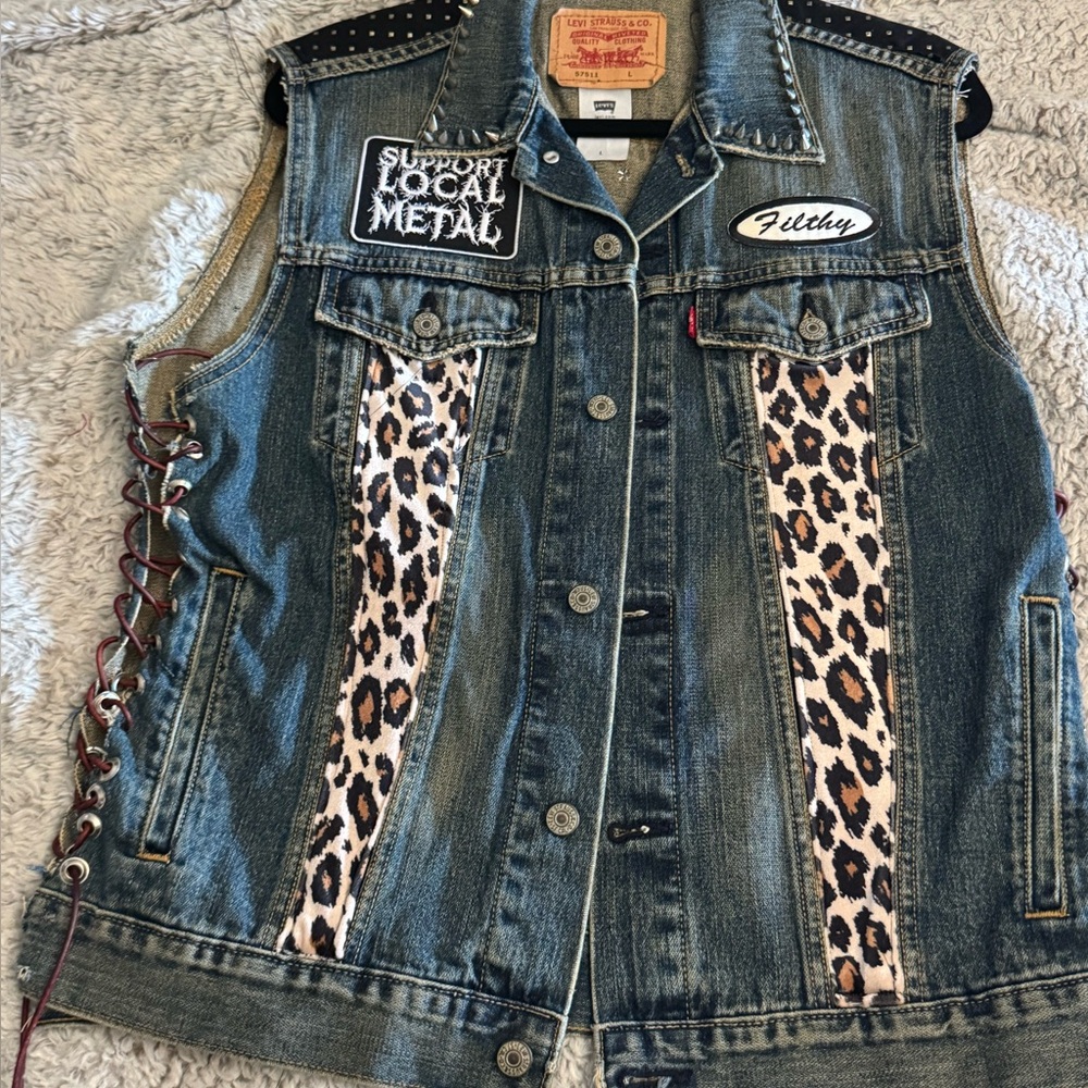 Levi's Denim Vest with Unique Accents to include studs, lacing, and some patches